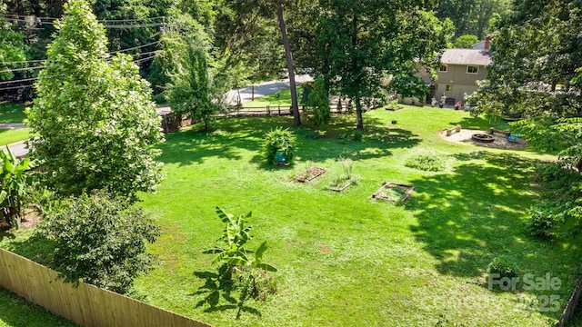 7015 Lavern St, Charlotte, NC 28215 - fenced backyard with an outdoor fire pit
