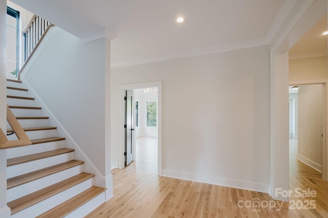 1625 Club Rd, Charlotte, NC 28205 - stairway featuring ornamental molding, wood finished floors, and recessed lighting