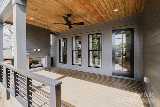 1625 Club Rd, Charlotte, NC 28205 - deck with exterior fireplace and a ceiling fan