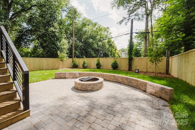 1625 Club Rd, Charlotte, NC 28205 - fenced backyard featuring an outdoor fire pit, a patio, and stairs