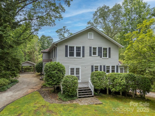 93 Villa Barbara Ln, Tryon, NC 28782 - rear view of property featuring a carport, a lawn, a wooden deck, and driveway