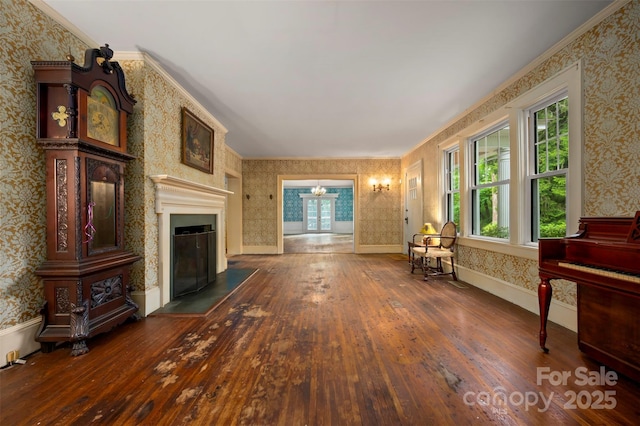 93 Villa Barbara Ln, Tryon, NC 28782 - living room featuring wallpapered walls, wood-type flooring, a fireplace, and crown molding