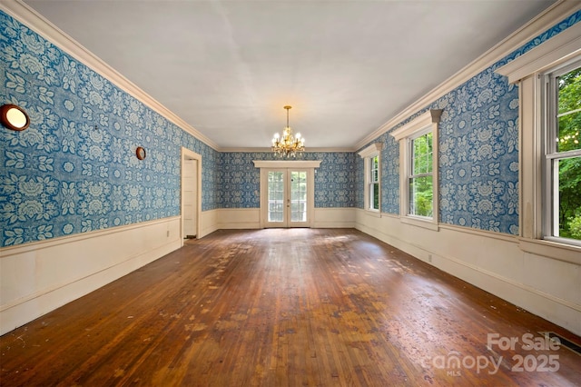 93 Villa Barbara Ln, Tryon, NC 28782 - unfurnished room with wood-type flooring, a wainscoted wall, a chandelier, crown molding, and healthy amount of natural light