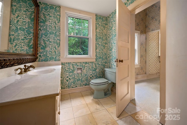 93 Villa Barbara Ln, Tryon, NC 28782 - bathroom featuring wallpapered walls, vanity, toilet, and baseboards