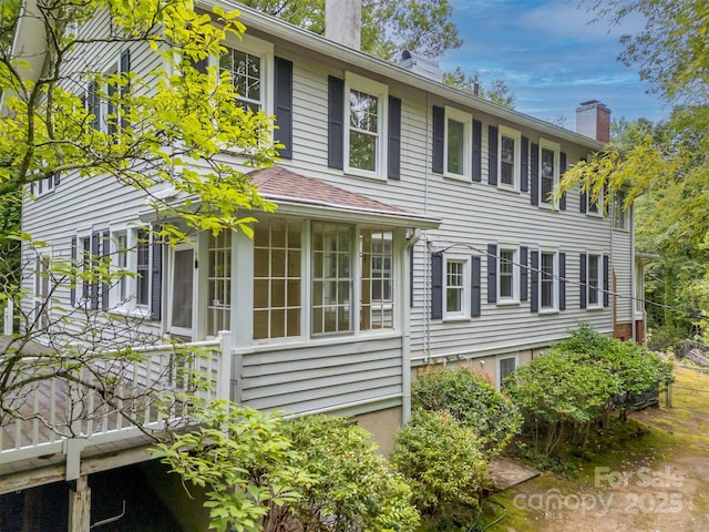 93 Villa Barbara Ln, Tryon, NC 28782 - view of home's exterior with a chimney and a shingled roof