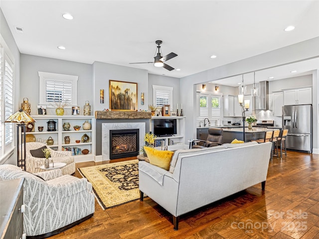 294 W Main St, Brevard, NC 28712 - living area with ceiling fan, a premium fireplace, dark wood-style flooring, and recessed lighting