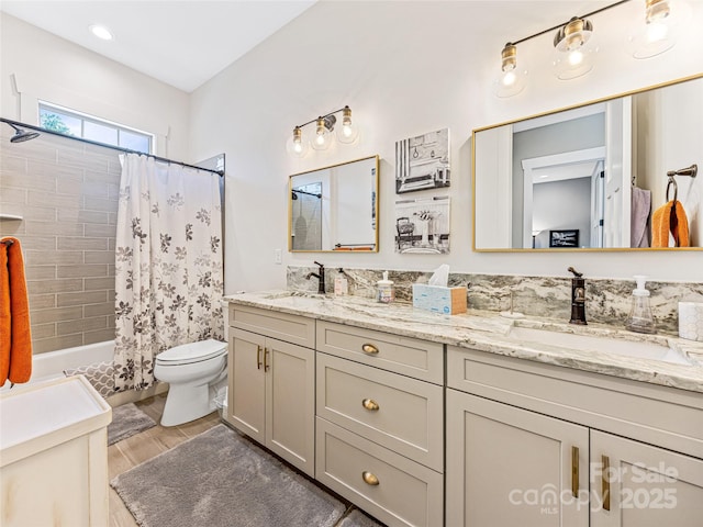 294 W Main St, Brevard, NC 28712 - bathroom featuring double vanity, toilet, shower / bath combination with curtain, and wood finished floors