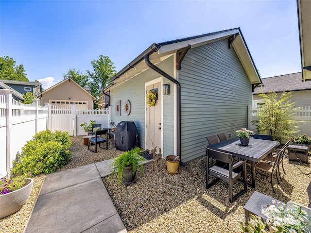 294 W Main St, Brevard, NC 28712 - view of home's exterior with a fenced backyard, a patio area, and outdoor dining space
