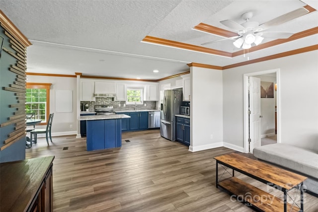 2021 Beamguard Rd, Clover, SC 29710 - living room with wood finished floors, ceiling fan, baseboards, ornamental molding, and stairway