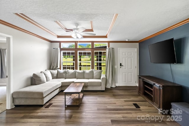 2021 Beamguard Rd, Clover, SC 29710 - living area featuring a textured ceiling, a ceiling fan, ornamental molding, wood finished floors, and a tray ceiling