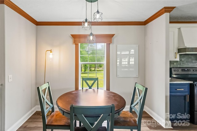 2021 Beamguard Rd, Clover, SC 29710 - dining space featuring wood finished floors, ornamental molding, and baseboards