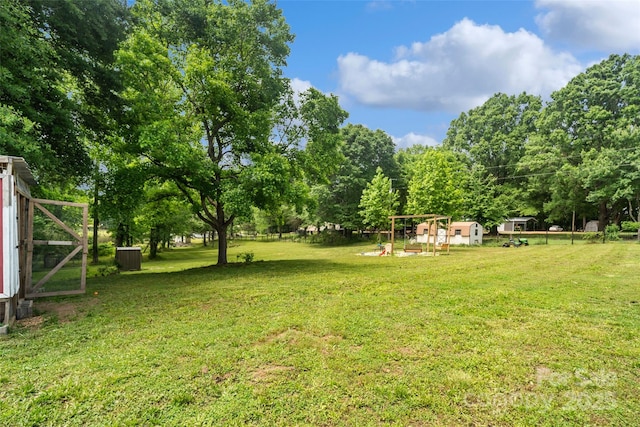 2021 Beamguard Rd, Clover, SC 29710 - view of grassy yard featuring an outdoor structure, central AC, and view of scattered trees
