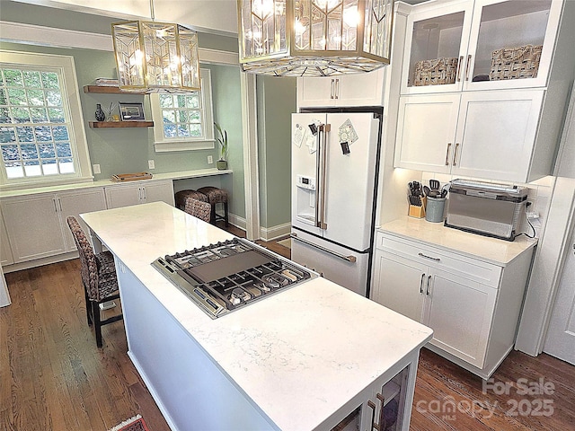 1051 14th Avenue Dr NW, Hickory, NC 28601 - kitchen featuring white refrigerator with ice dispenser, a chandelier, dark wood-style flooring, and black gas stovetop