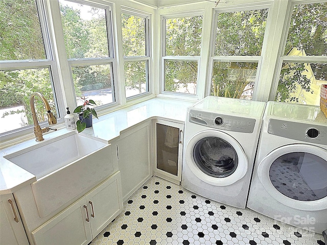 1051 14th Avenue Dr NW, Hickory, NC 28601 - washroom with washer and dryer, a sink, and light tile patterned floors