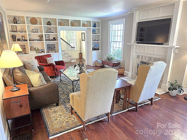 1051 14th Avenue Dr NW, Hickory, NC 28601 - living area with wood finished floors, stairway, built in shelves, a fireplace, and plenty of natural light