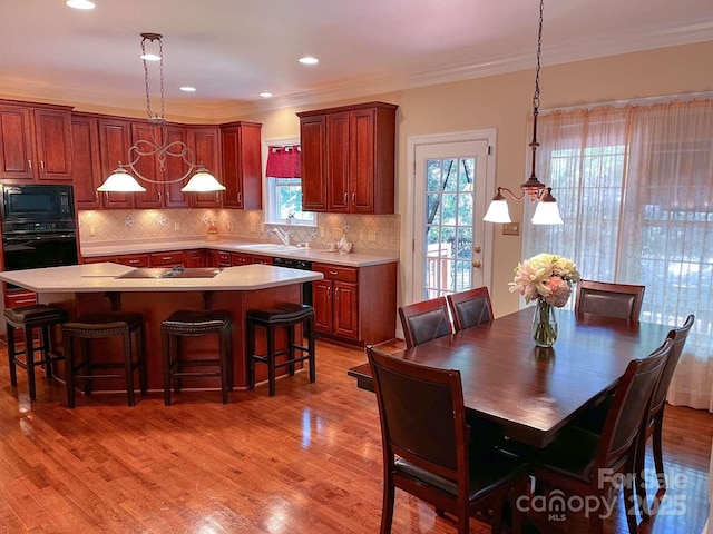 15494 Donnington Dr, Charlotte, NC 28277 - dining room with ornamental molding, light wood-style flooring, and recessed lighting