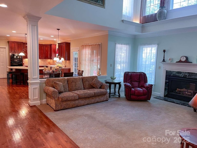 15494 Donnington Dr, Charlotte, NC 28277 - living area featuring ornate columns, plenty of natural light, recessed lighting, a premium fireplace, and a high ceiling