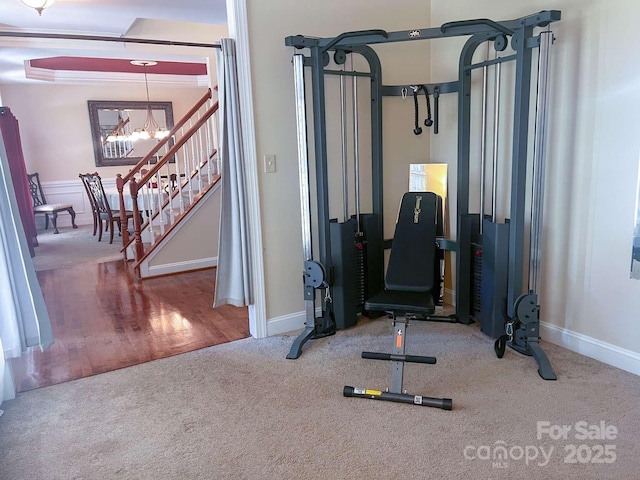 15494 Donnington Dr, Charlotte, NC 28277 - workout area with a chandelier, carpet flooring, and baseboards