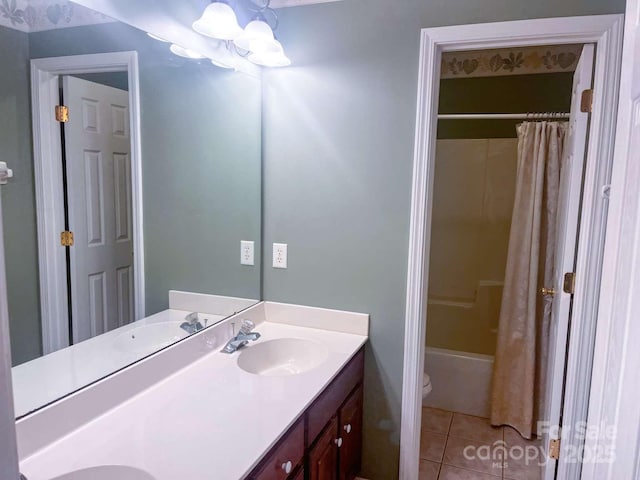 15494 Donnington Dr, Charlotte, NC 28277 - full bath featuring double vanity, toilet, tile patterned floors, shower / bath combo with shower curtain, and a chandelier