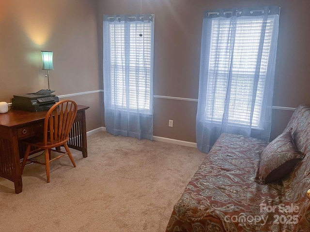 15494 Donnington Dr, Charlotte, NC 28277 - carpeted bedroom featuring multiple windows, baseboards, and a desk