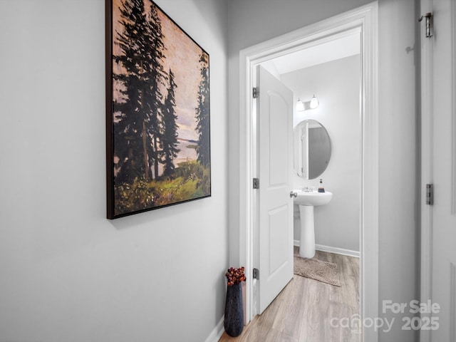 10426 Kempsford Dr, Charlotte, NC 28262 - hall featuring baseboards and wood finished floors