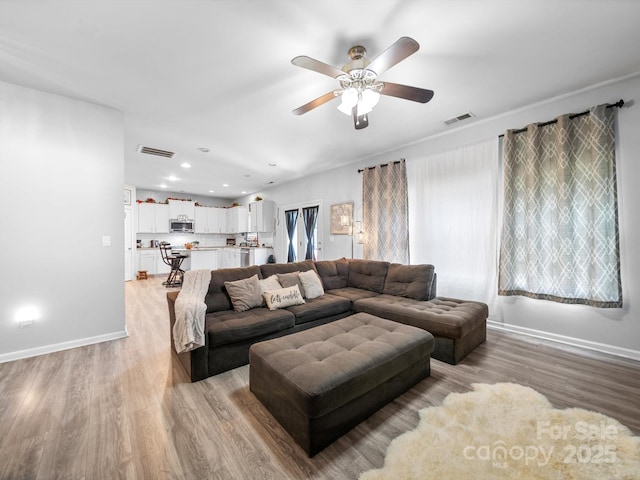 10426 Kempsford Dr, Charlotte, NC 28262 - living area featuring ceiling fan, light wood-type flooring, baseboards, and recessed lighting