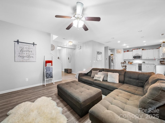10426 Kempsford Dr, Charlotte, NC 28262 - living area featuring a ceiling fan, wood finished floors, baseboards, and recessed lighting