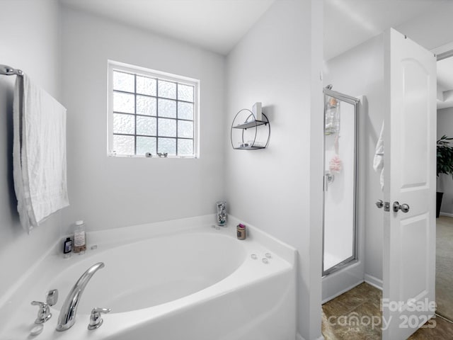 10426 Kempsford Dr, Charlotte, NC 28262 - full bathroom with a bath and a shower stall