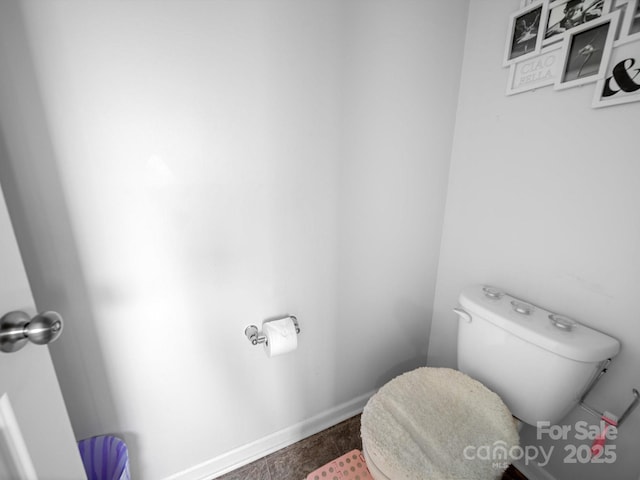 10426 Kempsford Dr, Charlotte, NC 28262 - bathroom featuring toilet and baseboards