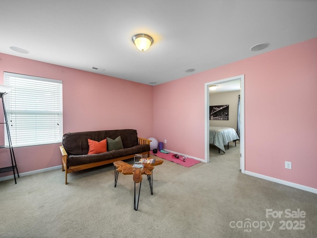 10426 Kempsford Dr, Charlotte, NC 28262 - carpeted living area with baseboards