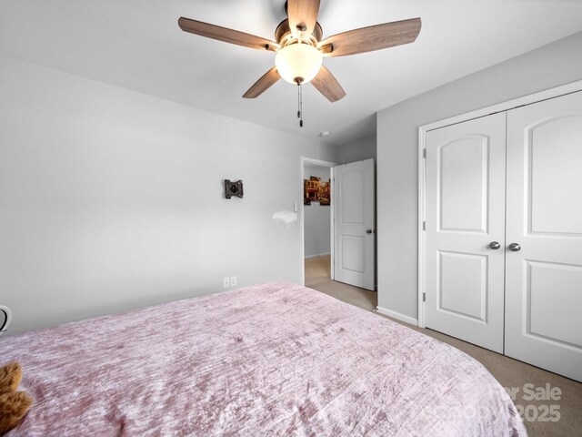 10426 Kempsford Dr, Charlotte, NC 28262 - bedroom featuring light colored carpet, a closet, ceiling fan, and baseboards