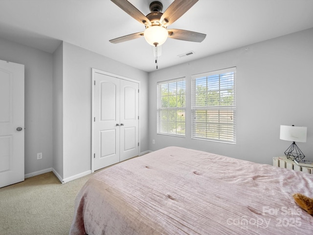 10426 Kempsford Dr, Charlotte, NC 28262 - carpeted bedroom featuring baseboards, a closet, and a ceiling fan