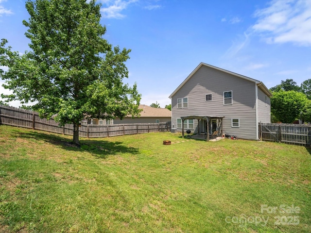 10426 Kempsford Dr, Charlotte, NC 28262 - back of property with an outdoor fire pit