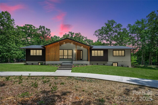 5033 Waxhaw Indian Trail Rd, Matthews, NC 28104 - view of front facade featuring a lawn