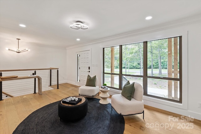 5033 Waxhaw Indian Trail Rd, Matthews, NC 28104 - living area featuring an upstairs landing, ornamental molding, light wood-type flooring, baseboards, and recessed lighting