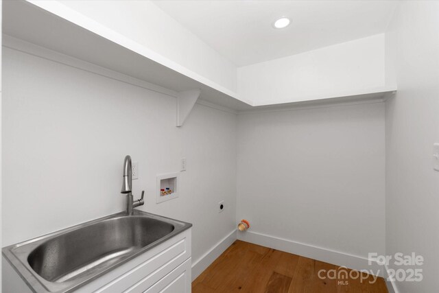5033 Waxhaw Indian Trail Rd, Matthews, NC 28104 - laundry area featuring a sink, hookup for a washing machine, electric dryer hookup, baseboards, and wood finished floors