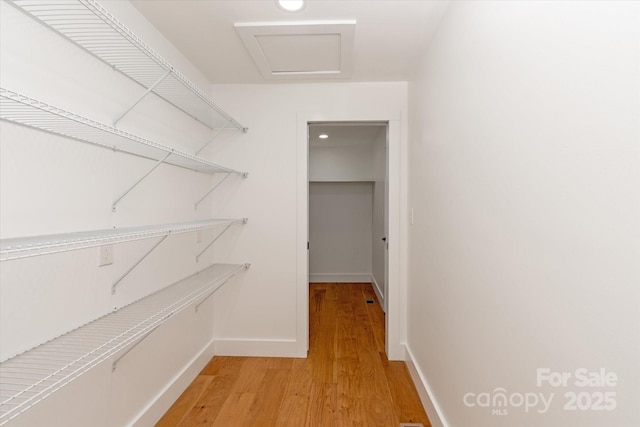 5033 Waxhaw Indian Trail Rd, Matthews, NC 28104 - spacious closet with light wood-type flooring and attic access