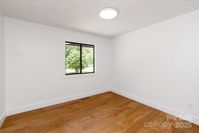 5033 Waxhaw Indian Trail Rd, Matthews, NC 28104 - unfurnished room with baseboards and light wood-style floors