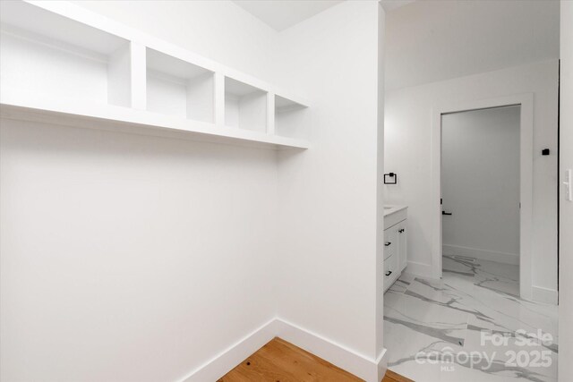 5033 Waxhaw Indian Trail Rd, Matthews, NC 28104 - mudroom featuring baseboards and light marble finish floors