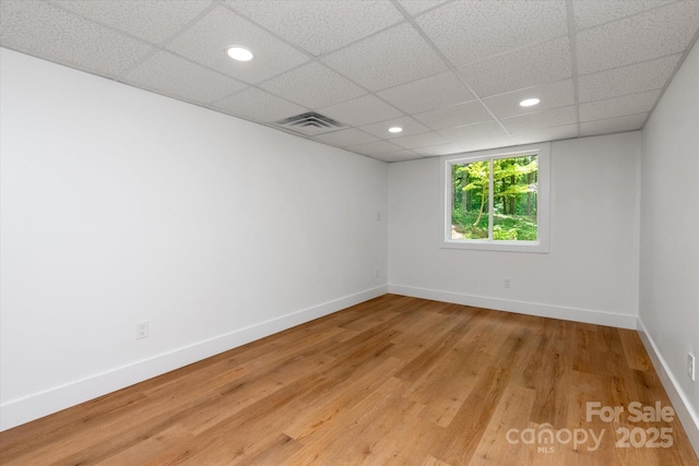 5033 Waxhaw Indian Trail Rd, Matthews, NC 28104 - empty room with light wood finished floors, baseboards, a paneled ceiling, and recessed lighting