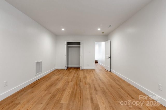 5033 Waxhaw Indian Trail Rd, Matthews, NC 28104 - unfurnished bedroom with recessed lighting, baseboards, light wood-type flooring, and a closet