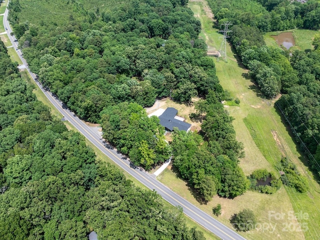 5033 Waxhaw Indian Trail Rd, Matthews, NC 28104 - aerial view of property's location featuring a heavily wooded area