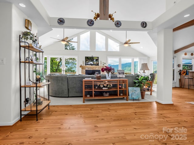 698 Youngs Mountain Dr, Lake Lure, NC 28746 - living area featuring a ceiling fan, wood finished floors, recessed lighting, baseboards, and a fireplace