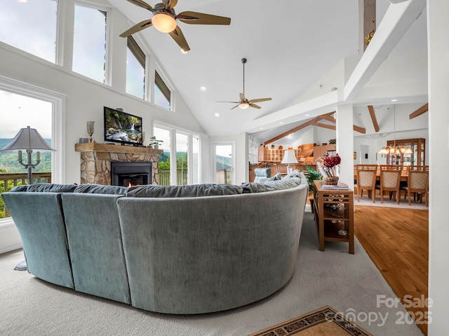 698 Youngs Mountain Dr, Lake Lure, NC 28746 - living room featuring a ceiling fan, high vaulted ceiling, a stone fireplace, wood finished floors, and recessed lighting