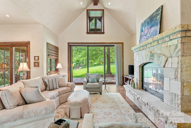 577 Walnut Valley Pkwy, Arden, NC 28704 - living room featuring high vaulted ceiling, a fireplace, and wood finished floors