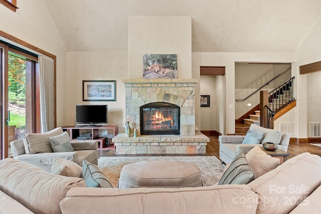 577 Walnut Valley Pkwy, Arden, NC 28704 - living room featuring vaulted ceiling, a fireplace, stairway, wood finished floors, and baseboards