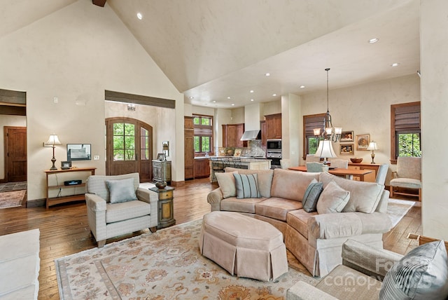 577 Walnut Valley Pkwy, Arden, NC 28704 - living room featuring hardwood / wood-style floors, high vaulted ceiling, recessed lighting, beam ceiling, and a chandelier