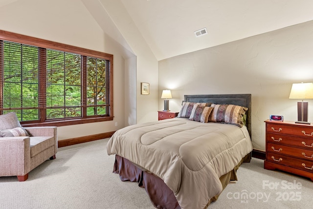 577 Walnut Valley Pkwy, Arden, NC 28704 - bedroom featuring light colored carpet, vaulted ceiling, and baseboards