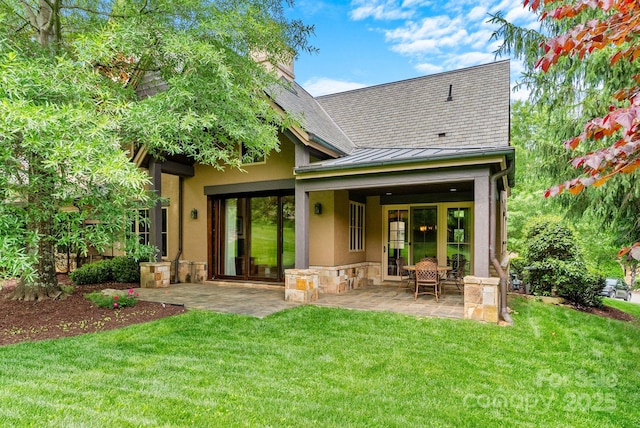 577 Walnut Valley Pkwy, Arden, NC 28704 - back of property featuring a standing seam roof, a patio, stucco siding, a lawn, and stone siding