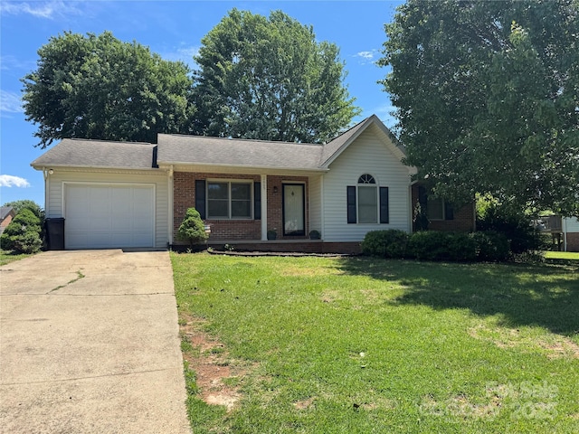 2669 Icard Rhodhiss Rd, Connelly Springs, NC 28612 - single story home featuring an attached garage, concrete driveway, brick siding, a front lawn, and covered porch